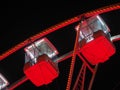 Bergamo, Italy. The Ferris wheel illuminated in red in the evening. Christmas time Royalty Free Stock Photo