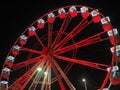 Bergamo, Italy. The Ferris wheel illuminated in red in the evening. Christmas time Royalty Free Stock Photo