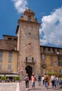 Bergamo, Italy - May 10, 2018: Bergamo clock tower. Torre Dell`Orologio in Piazza della Cittadella. Tourists on the Royalty Free Stock Photo
