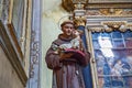 BERGAMO, ITALY - MAY 22, 2019: Statue of the man with the holy baby in hands in the Catholic Church of Sant Agata nel Carmine in