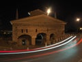 Bergamo, Italy. The old city. Landscape at the old gate San Giacomo door during the evening with trails of headlights Royalty Free Stock Photo