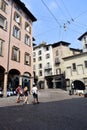 Bergamo / Italy / September 7 2018 : The lower town of Bergamo. In shaded arcades people go shopping, eating. Cobbled streets