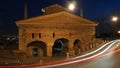 Bergamo, the old city. Landscape on the old gate named San Giacomo door during the evening with trails of headlights Royalty Free Stock Photo