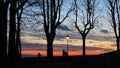 Bergamo, the old city. Lombardy, Italy. Silhouette of a person who admires the sunset towards the Po Valley from the ancient walls Royalty Free Stock Photo