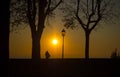 Bergamo old city. Lombardy, Italy. Silhouette of a person who admires the sunset towards the Po Valley Royalty Free Stock Photo