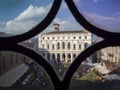 Bergamo, the old town. Landscape at the public library through the Venetian windows of the ancient administration building Royalty Free Stock Photo