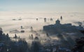 Bergamo, Italy. Lombardy. Amazing landscape of the fog rises from the plains and covers the old town Royalty Free Stock Photo