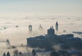 Bergamo, Italy. Lombardy. Amazing landscape of the fog rises from the plains and covers the old town Royalty Free Stock Photo