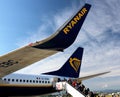 2019.09.30 Bergamo, Orio al Serio airport Ryanair plane in the foreground with passengers who board the plane in the back Royalty Free Stock Photo