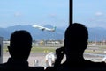 2019.09.30  Bergamo, Orio al Serio airport Ryanair plane parked in the foreground with silhoutte of passengers in backlight and in Royalty Free Stock Photo