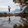 Bergamo player Bagpipe is reflected in a pool of water Royalty Free Stock Photo