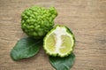 Bergamot fruit with green leafs on wood background Royalty Free Stock Photo