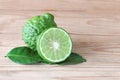 The Bergamot with green leafs on wood background Royalty Free Stock Photo