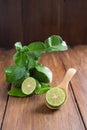 Bergamot with green leafs on wood background Royalty Free Stock Photo