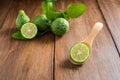 Bergamot with green leafs on wood background Royalty Free Stock Photo