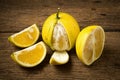 Bergamot oranges color yellow on pink wood Royalty Free Stock Photo