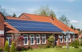 Bergen, Germany - April 30, 2017: Solar energy panel on a house roof on the blue sky background. Royalty Free Stock Photo