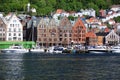 BERGEN HARBOR, NORWAY - MAY 27, 2017: Private boats on a row along the pier and crusskip a sunny day in May.