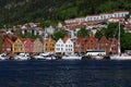 BERGEN HARBOR, NORWAY - MAY 27, 2017: Private boats on a row along the pier and crusskip a sunny day in May.