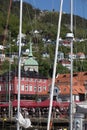 BERGEN HARBOR, NORWAY - MAY 27, 2017: Private boats on a row along the pier and crusskip a sunny day in May.