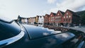 Bergen, Norway - August 2017: old Bryggen town houses reflection in retro car