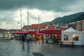 Bergen, Norway - July 30, 2013: Photo of Bergen Waterfront on a rainy evening. The coastline of the port of Bergen