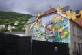 Wall murals add bright color to the city streest of Bergen, Norway especially on grey, cloudy, overcast days