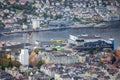 Yellow Helicopter in Flight Over the Port in Bergen in Western Norway Royalty Free Stock Photo