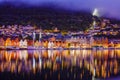 Bergen street at night with boats in Norway