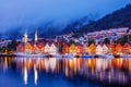 Bergen street at night with boats in Norway