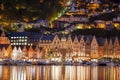 Bergen street at night with boats in Norway, UNESCO World Heritage Site