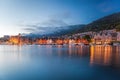 Bergen street at night with boats in Norway, UNESCO World Heritage Site