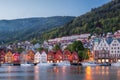 Bergen street at night with boats in Norway, UNESCO World Heritage Site