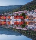 Bergen street at night with boats in Norway, Unesco World Heritage Site