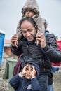 Family of refugees, a father and two children, waiting to cross the Croatia Serbia border, on the Balkans Route