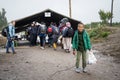 Young refugee boy standing and waiting to cross the Croatia Serbia border, between the cities of Bapska and Berkasovo