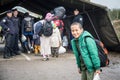 Young refugee boy standing and waiting to cross the Croatia Serbia border, between the cities of Bapska and Berkasovo