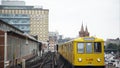 BERLIN - AUGUST 21: Locked down shot of a yellow tram arriving Oberbaum bridge