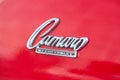 Berlin - August 2022: red vintage retro oldtimer Chevrolet Camaro SS 350 back side chrome emblem sign logo close up