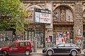 Berlin, cars parked in front of dilapidated Kunsthaus Tacheles