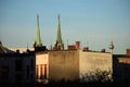 Berlin cityscape with two metal green copper church roofs and TV tower Germany