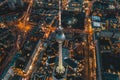 Berlin, Germany Alexanderplatz TV Tower after Sunset at Dusk with beautiful lit up Streets in orange lights of a Big Royalty Free Stock Photo