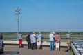 Airplane spotters looking at airplanes at the observations deck at Berlin Tegel airport Royalty Free Stock Photo