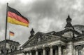 Germany flag in front of Reichstag building in city Berlin, Germany Royalty Free Stock Photo