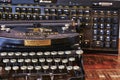 Historic typewriter and modern keyboard that show the progress of the last 100 years