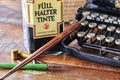 Historical writing utensils on a wooden table