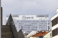 Berlin, Germany - April 11, 2025: A modern hospital building featuring the CharitÃÂ© logo surrounded by traditional struct Royalty Free Stock Photo