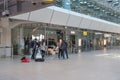 A news team TV is creating content in the empty main Airport Terminal - A, at Berlin Tegel `Otto Lilienthal` Airport,