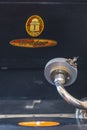 Pickup of a gramophone from Germany in the twenties with a shellac disc in the foreground and the logo of the company Odeon in the