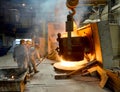 Berlin, Germany - April 18, 2013: Production of metal components in a foundry - group of workers Royalty Free Stock Photo